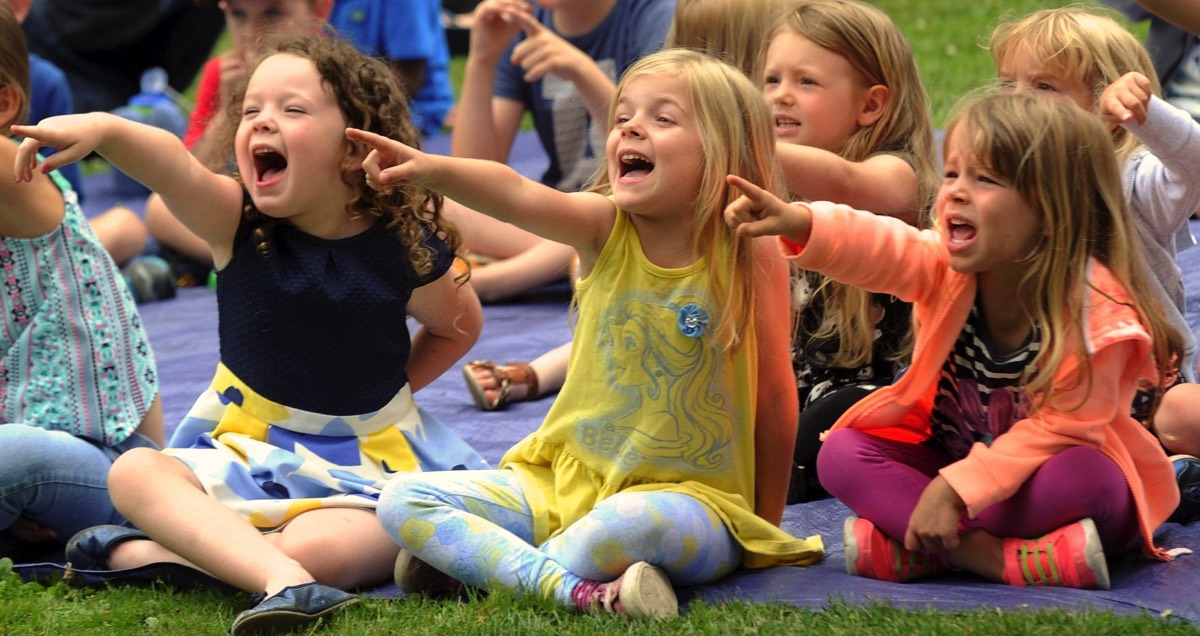 kids watching a puppet show London